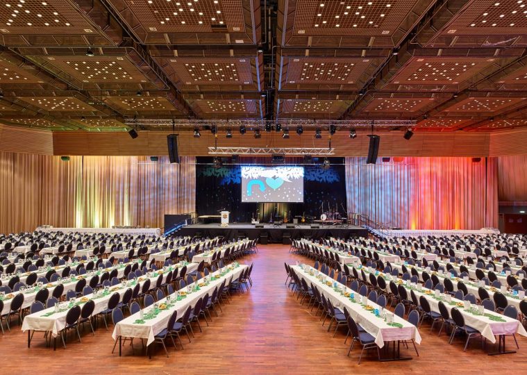 Grand Hall in the Saarlandhalle with banquet seating in the interior for graduation ball
